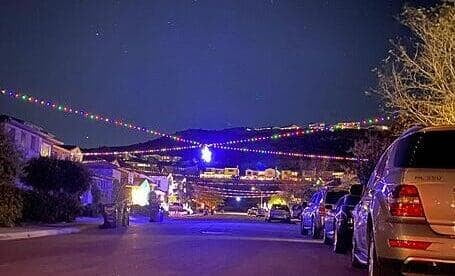 Christmas Lights Installation with Star over street