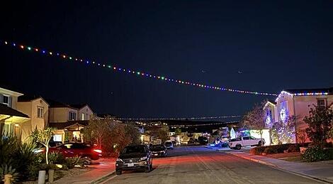 Neighborhood Christmas Light Strings over street