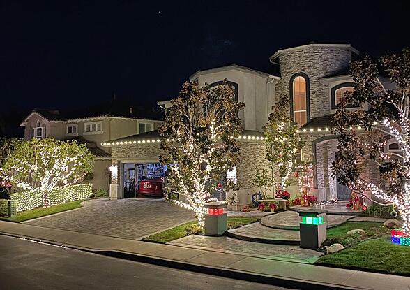 Bright White Christmas Lights on House and Trees with Decorations